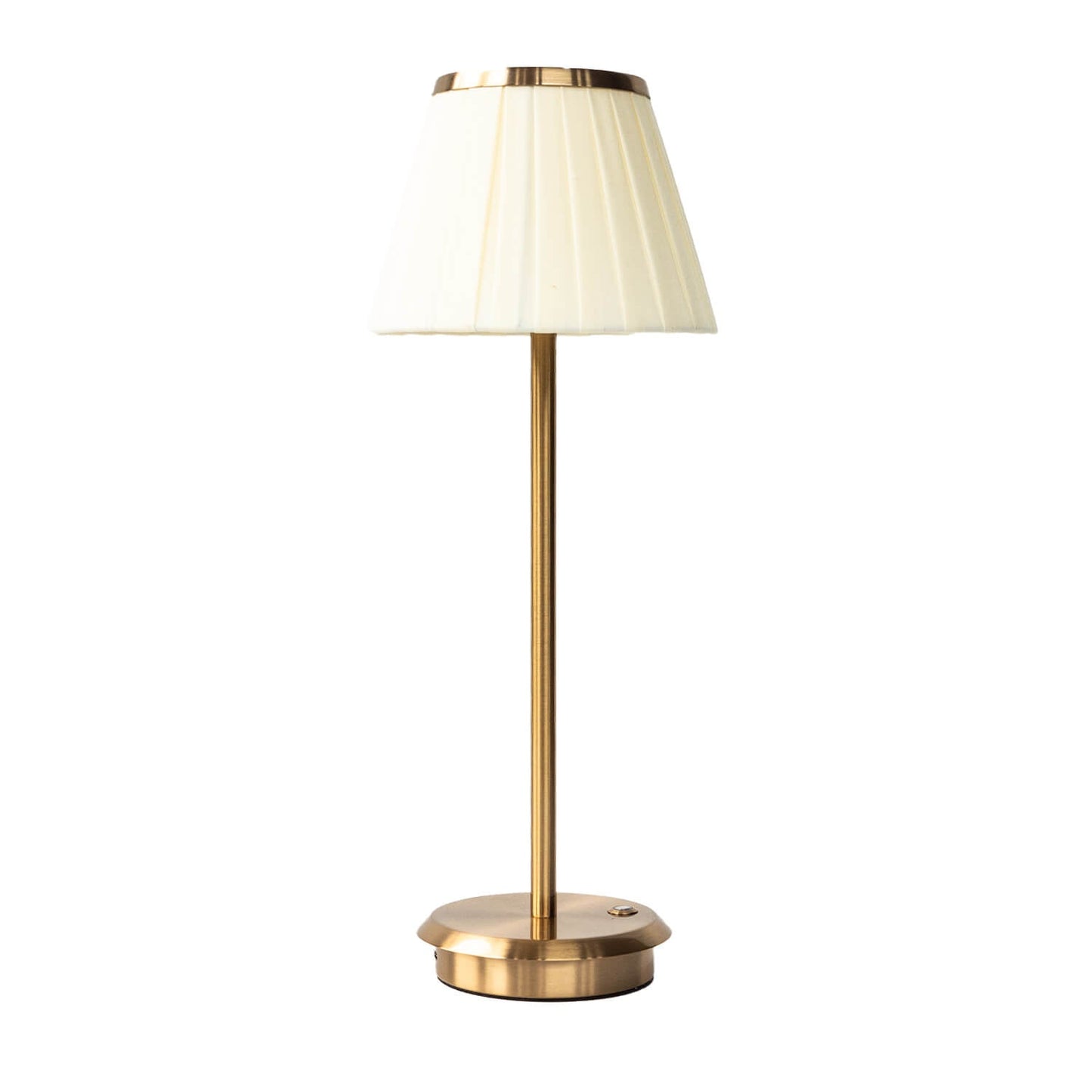 Table lamp with white pleated shade and gold base on a white background
