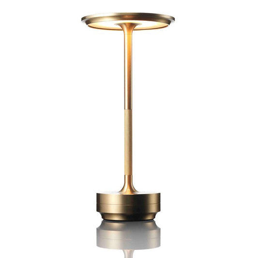 Gold-coloured lamp on a white background