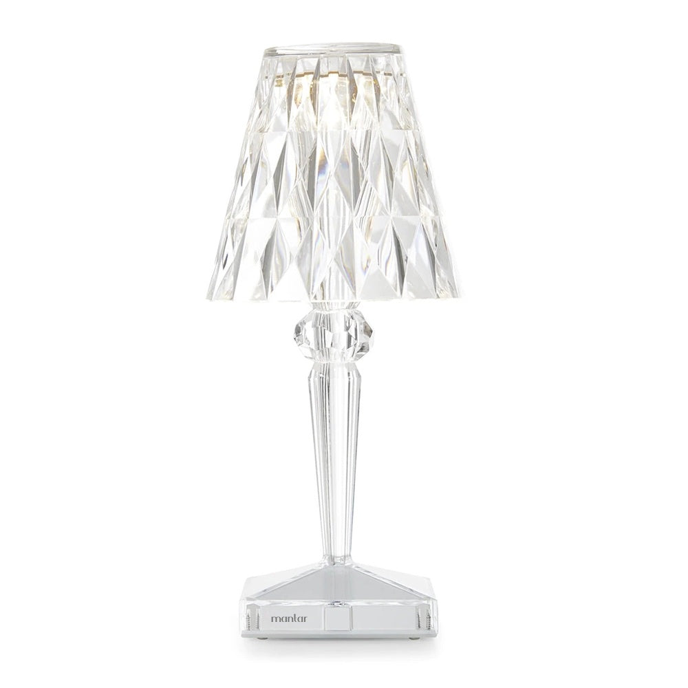 Clear crystal table lamp on a white background