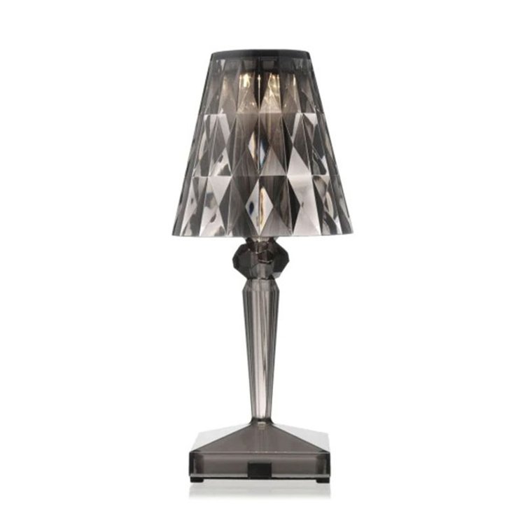 Table lamp with a smoked glass shade on a white background