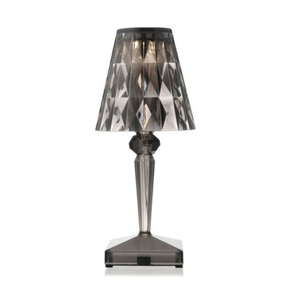 Table lamp with a smoked glass shade on a white background