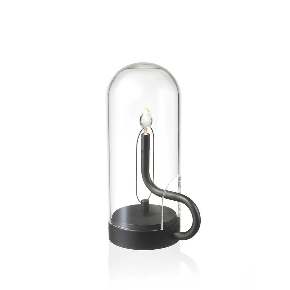 Candle in a glass dome on a white background
