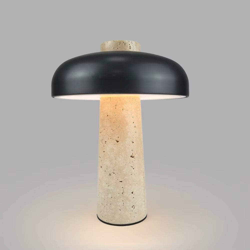 Table lamp with black shade and textured beige base on a gray background
