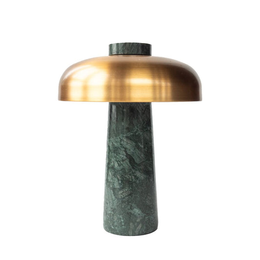 Table lamp with brass shade and green marble base on a white background